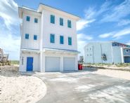Modern coastal piling home on Navarre Beach by Acorn Fine Homes - Thumb Pic 1
