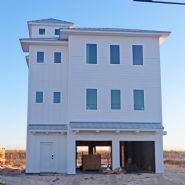 Smith coastal transitional style piling home on Navarre Beach