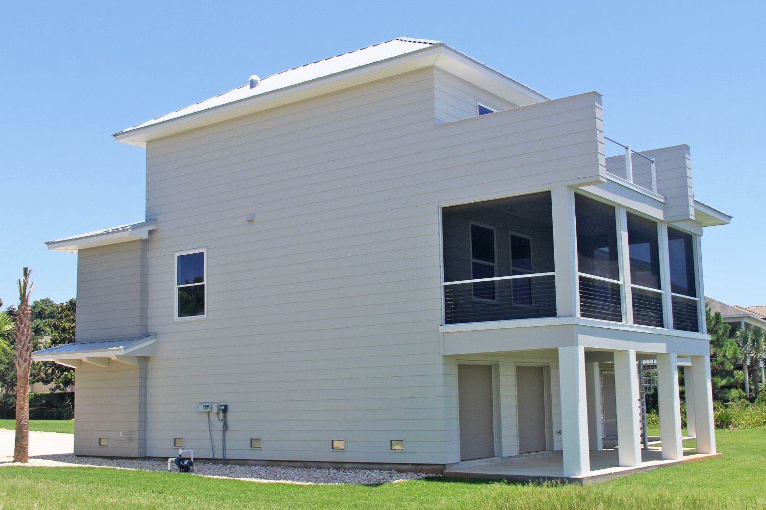 Modern piling home in Navarre by Acorn Fine Homes