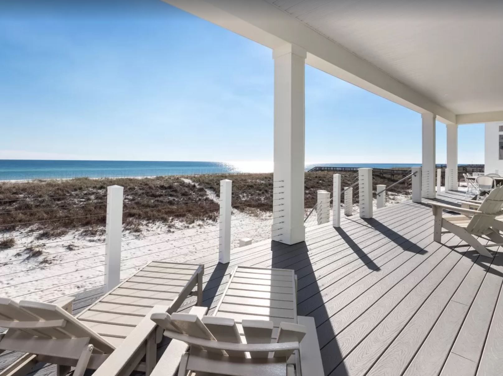 Antinnes modern coastal piling home on Navarre Beach by Acorn Fine Homes