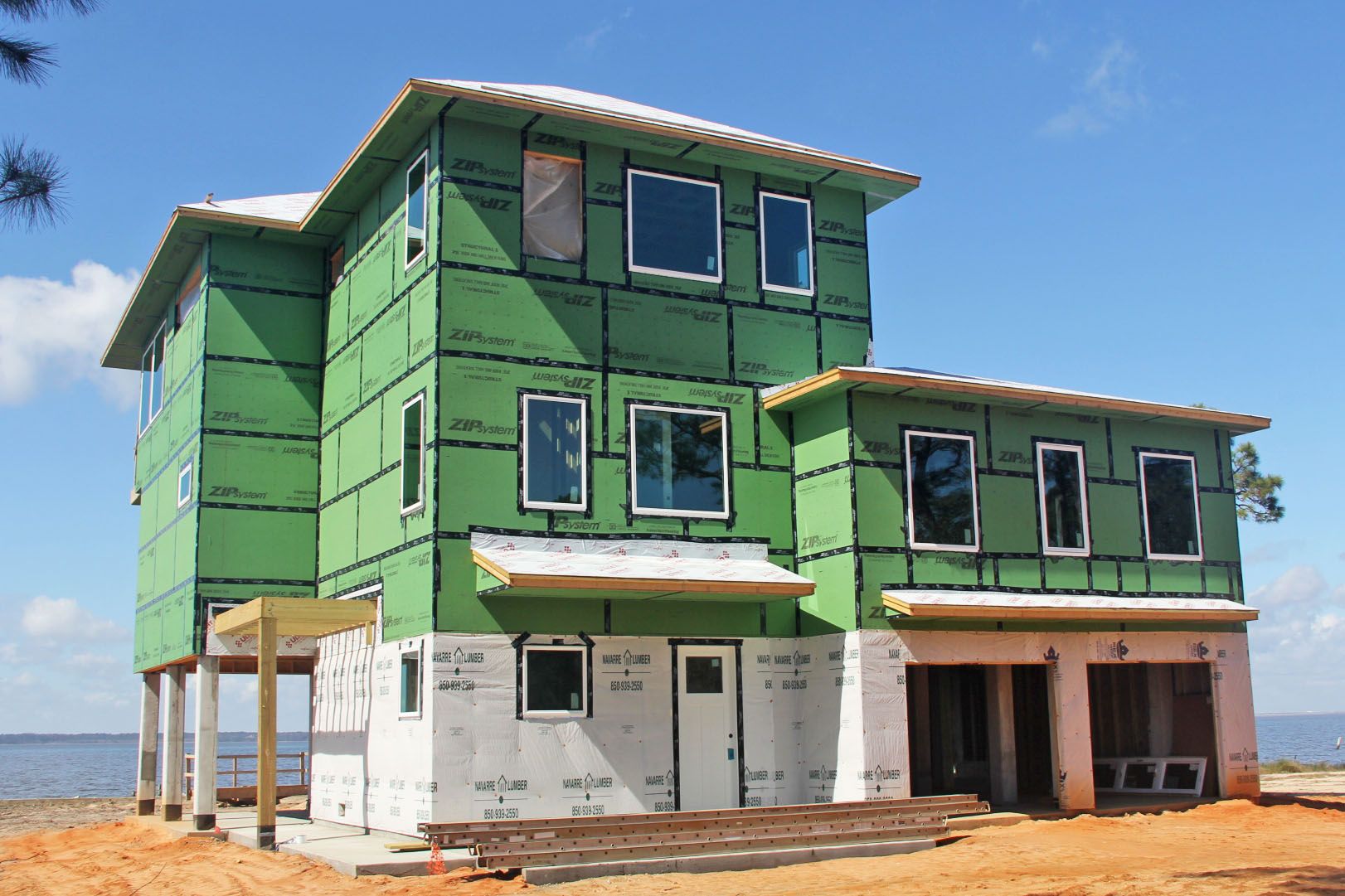 Modern piling home in Navarre by Acorn Fine Homes