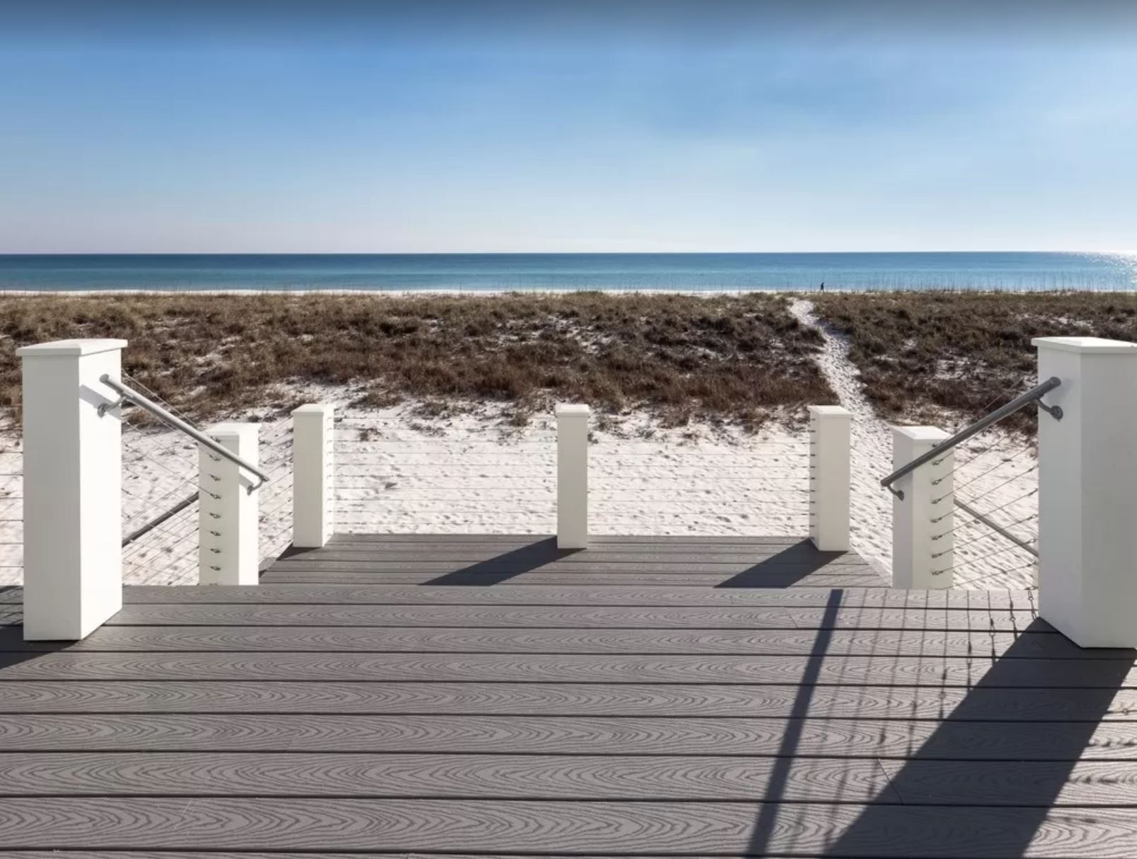 Antinnes modern coastal piling home on Navarre Beach by Acorn Fine Homes