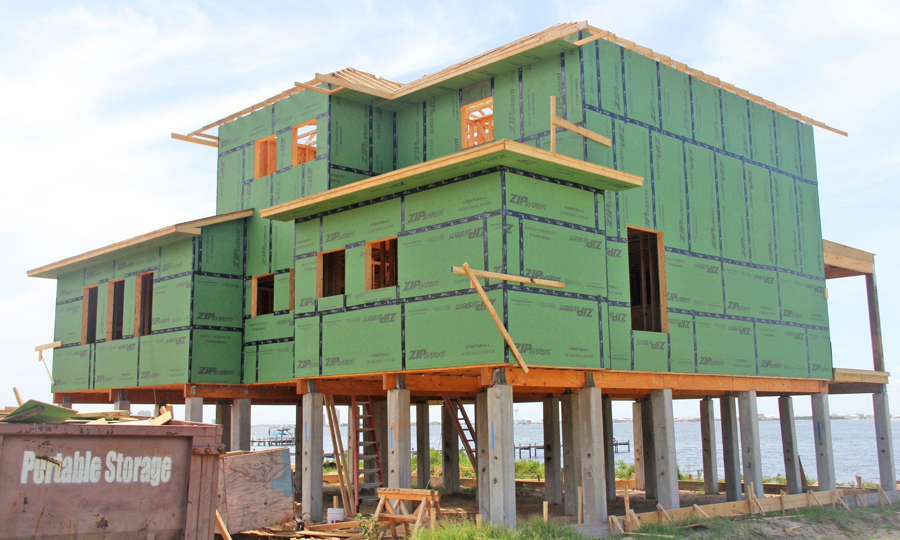 Modern piling home in Navarre by Acorn Fine Homes