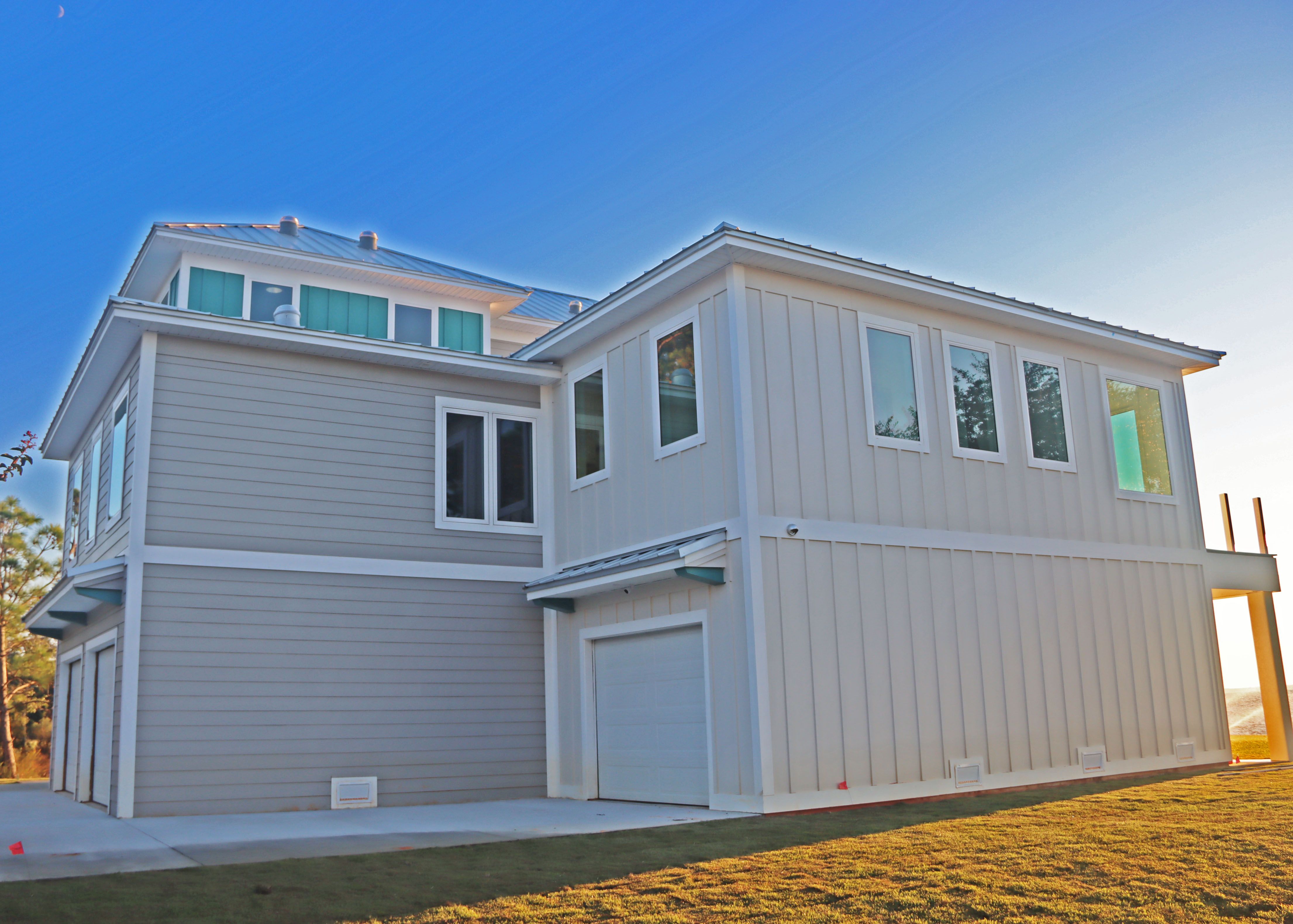 Modern piling home in Navarre, Gulf Breeze, Milton by Acorn Fine Homes