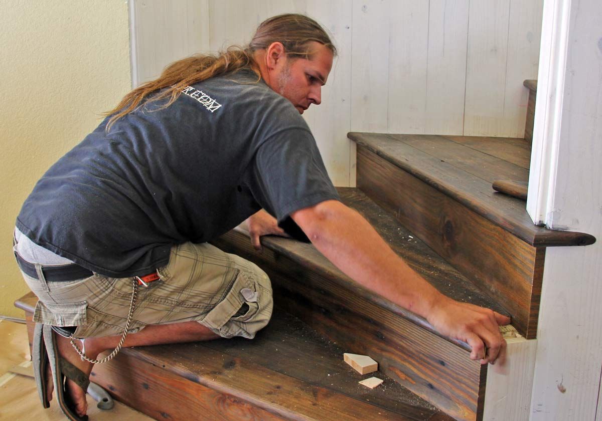 installing reclaimed hear pine floors by Acorn Fine Homes