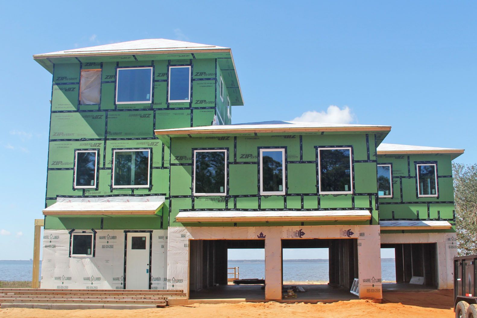 Modern piling home in Navarre by Acorn Fine Homes