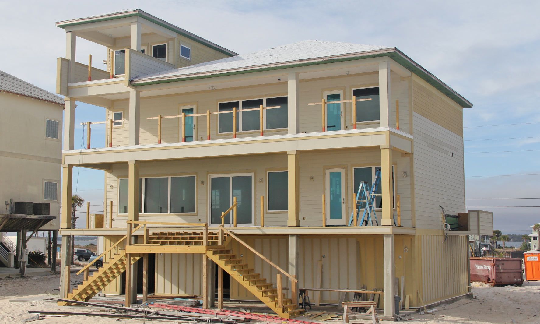 Antinnes concrete piling home on Navarre Beach by Acorn Fine Homes