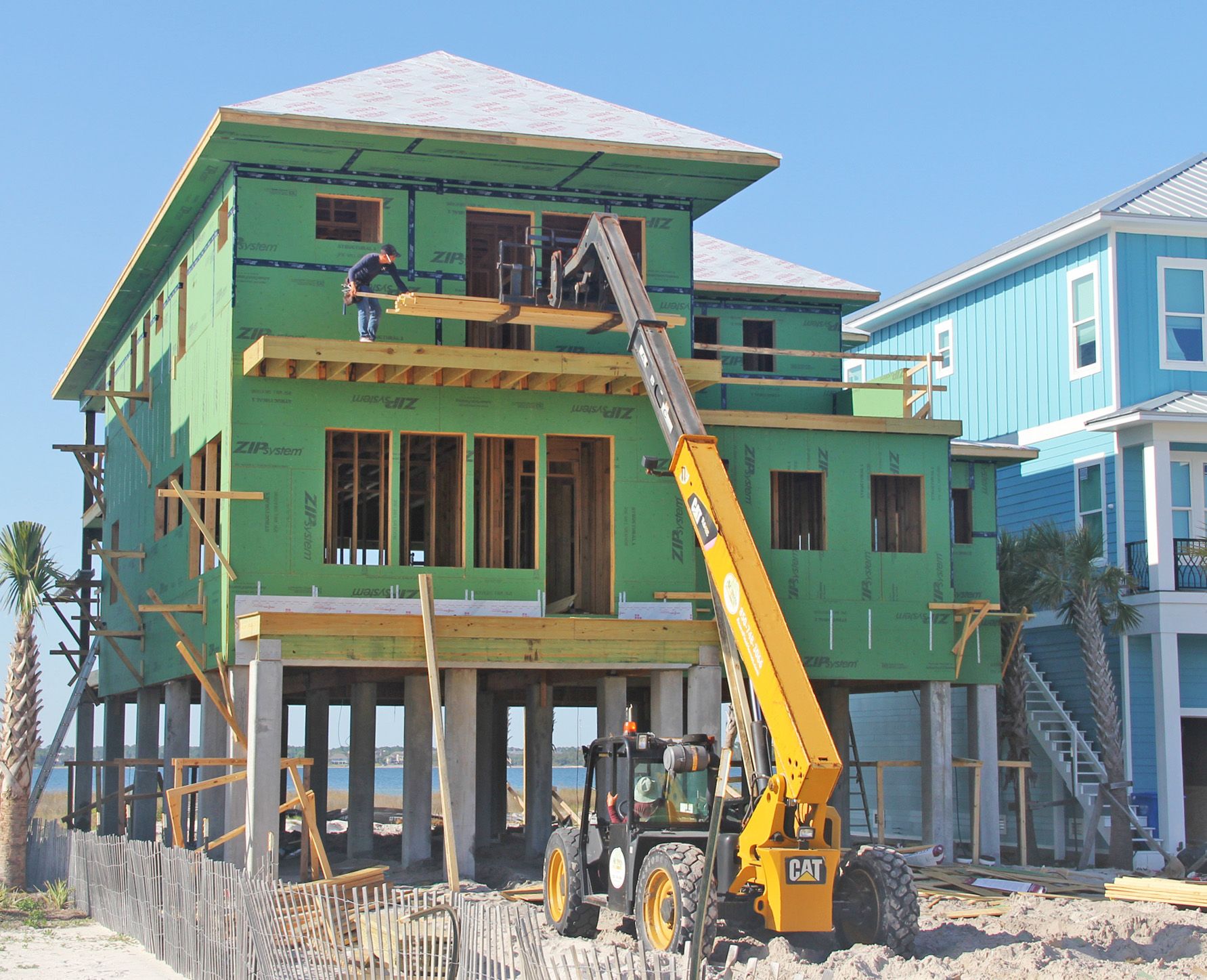 Modern piling home in Navarre by Acorn Fine Homes