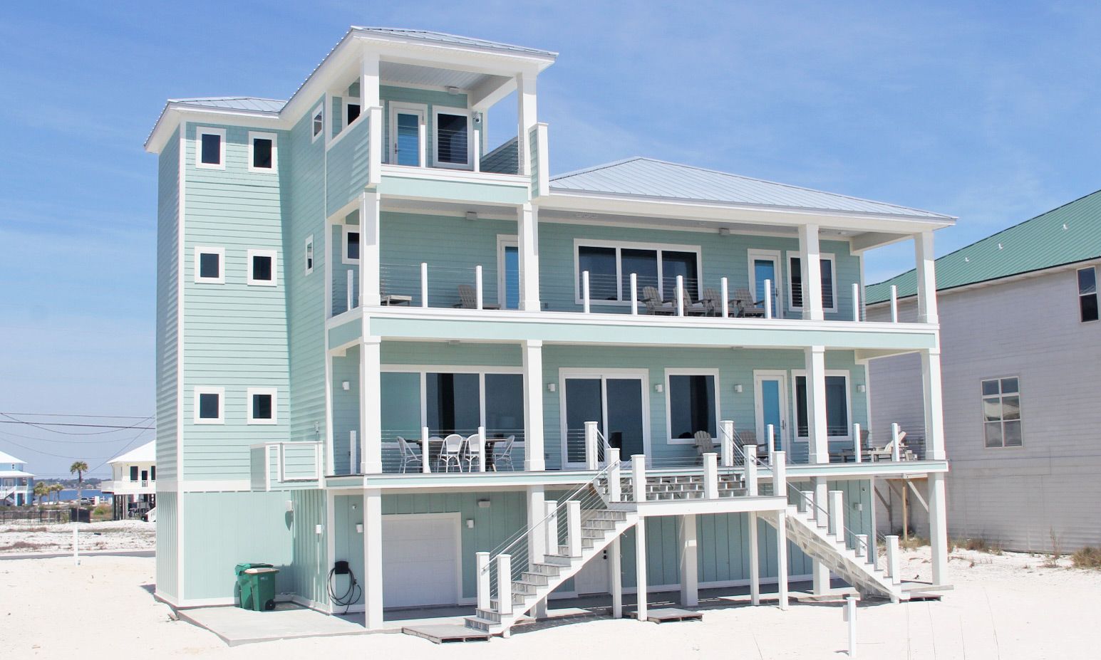 Antinnes modern coastal piling home on Navarre Beach by Acorn Fine Homes